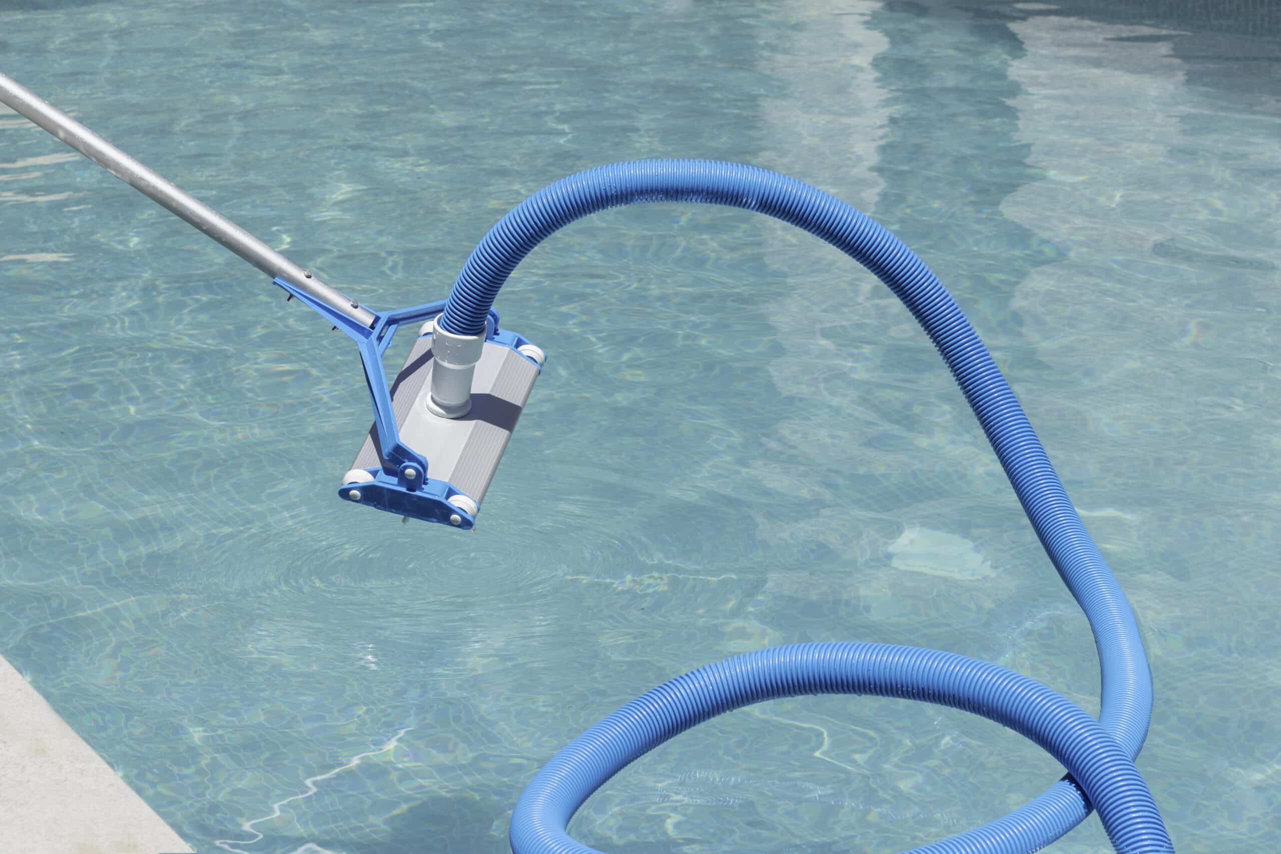 Close up view of automatic swimming pool cleaner before entering the water with water background. Summer activity